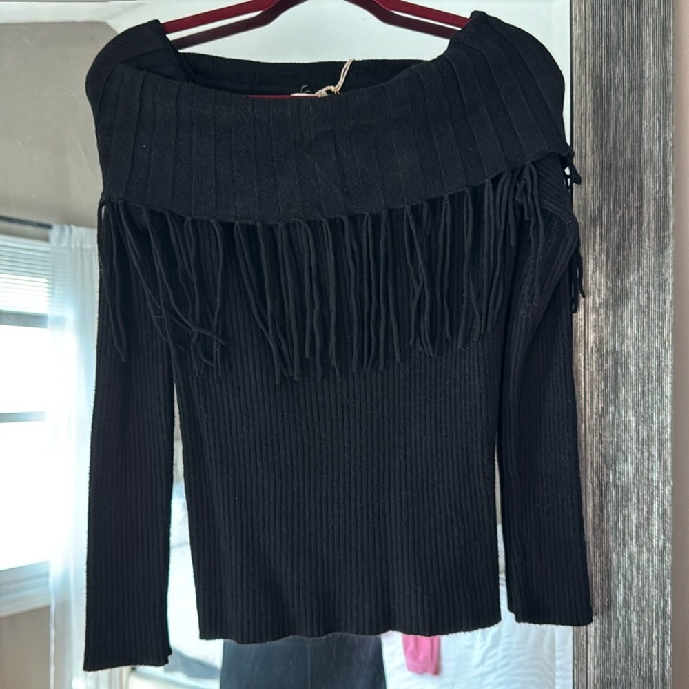 Black off the shoulder sweater with fringe